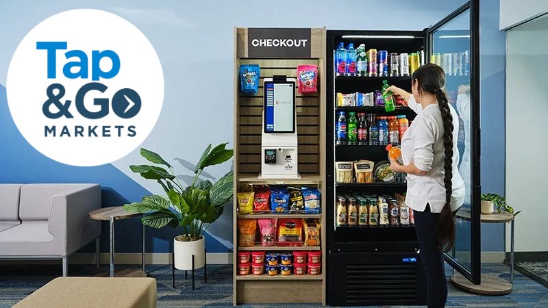 Tap & Go branded market with self-checkout, snack shelving and a drink cooler